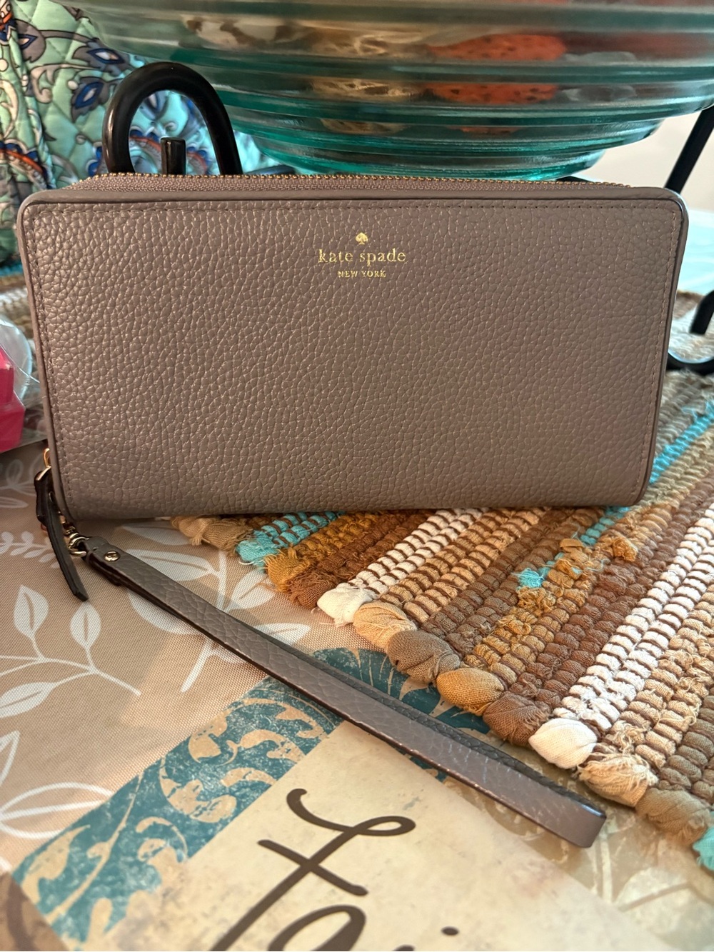kate spade taupe pebbled leather zip wristlet with gold logo